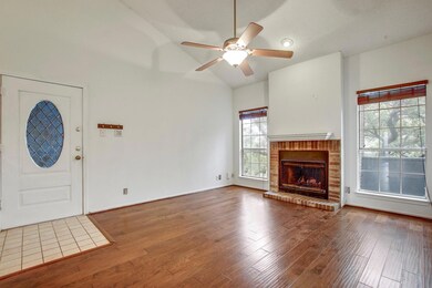 Unfurnished living room featuring high vaulted ce