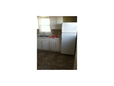 Kitchen has new vinyl flooring.