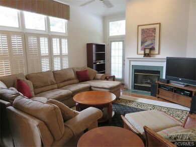 Living Room with Fireplace and Plantation Shutters