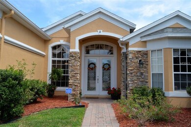 Front entry with brick paver walkway, porch & doub