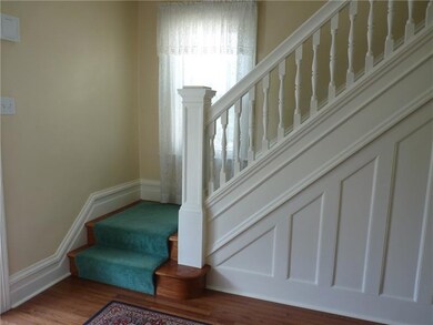 Entry with hardwood floor and stairs