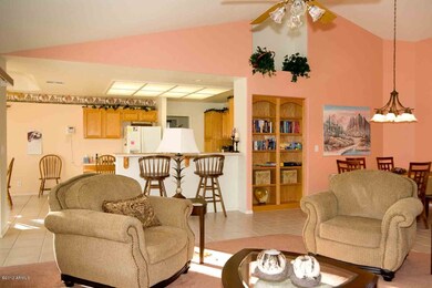 View of living, kitchen and dining area.