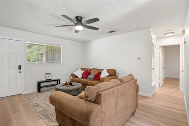 Living room featuring light wood-style flooring, 