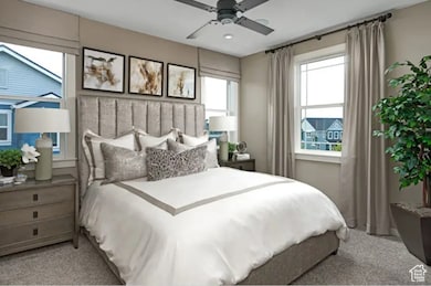 Bedroom featuring light carpet and ceiling fan