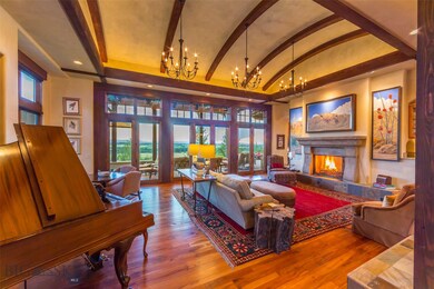 Barrel vaulted living room with covered porch an e