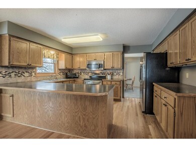 Kitchen features generous cabinetry, stainless ste