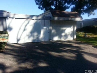 The door to the right of the small gate is the dir
