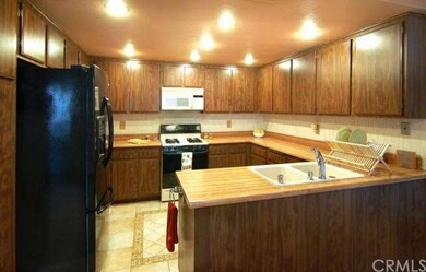 Kitchen with custom tile floors and all appliances