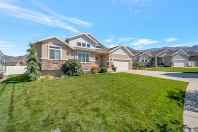 Craftsman inspired home with stone siding, driveway, a residential view, and an attached garage