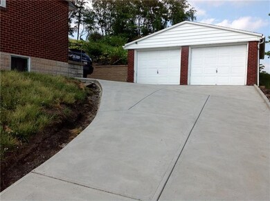 Large two car detached garage and brand new drivew