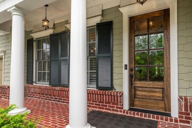 Cozy front porch overlooks cul de sac