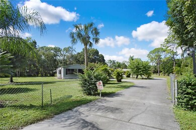 Electric Front Gate with backup Power Supply and long paved Driveway