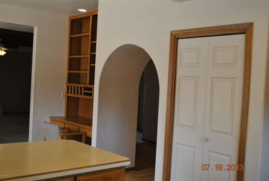 Arched entry to and from kitchen