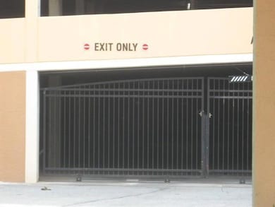 Exterior view of stucco siding and a gate