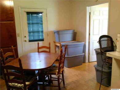 View from edge of livingroom to dining area and laundry room door.