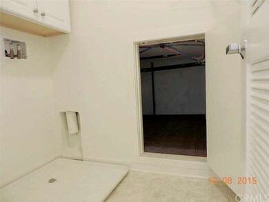 Laundry room has extra storage built out under ups