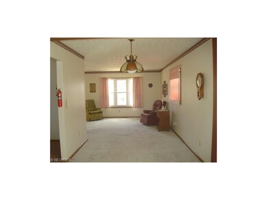Hardwood floors under carpet in living and dining 