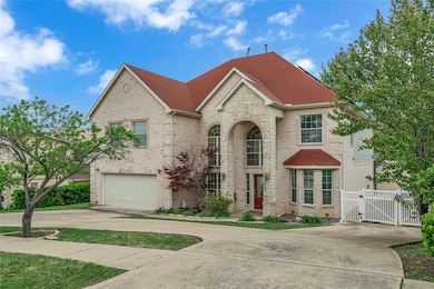 Traditional home featuring a gate, driveway, a shi