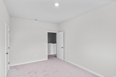 Empty room with light carpet