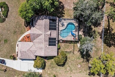 Closer aerial view highlights the inviting pool an