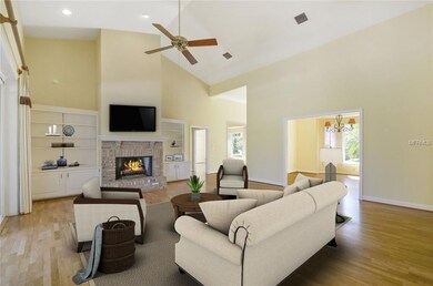 Family Room with brick fireplace, wood floors and 