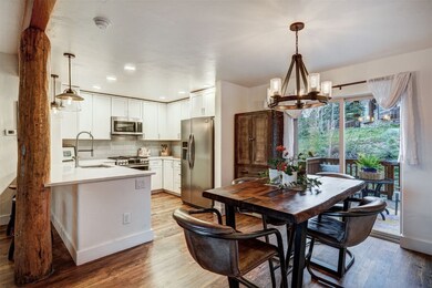 Dining space with a chandelier, light wood-type fl