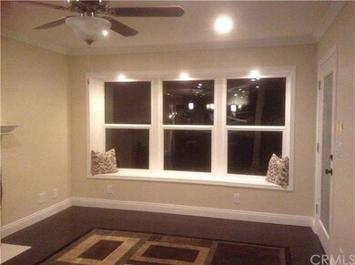 Living room window seat with recessed lighting.
