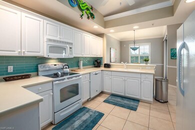Blue Glass Backsplash and Plenty of Counter Space