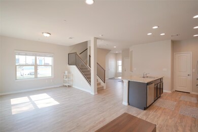 Kitchen featuring a sink, light wood-style floors