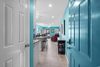 Entrance foyer featuring ceiling fan