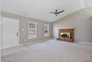 Livingroom with view of front entry, 9 ft. vaulted