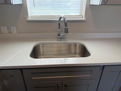 Room details featuring light stone counters, gray