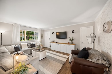 The space is accented with a modern white brick wa