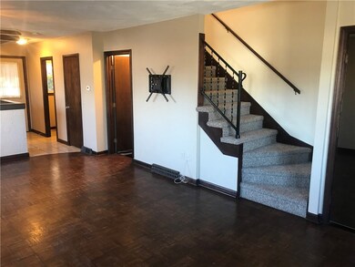 half bath, pantry, door to basement/storage for un