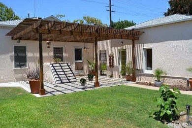 Back yard patio with access to cellar.