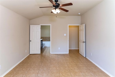 Unfurnished bedroom with lofted ceiling, light ti