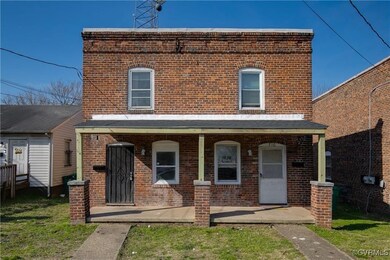 Multi unit property featuring brick siding and a p