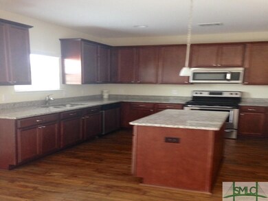 OPEN KITCHEN WITH GRANITE COUNTER TOPS AND STAINLE