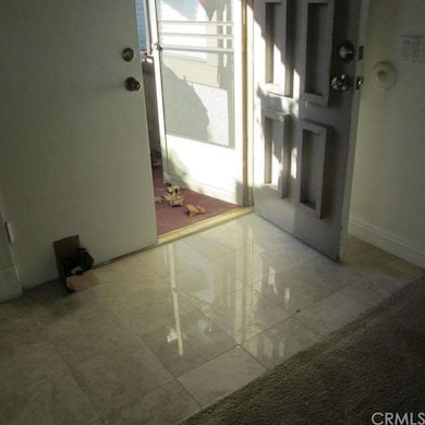 Double door entry with marble flooring