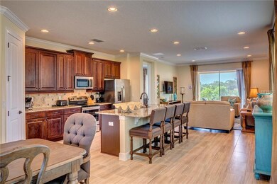 Spacious Great Room with upgraded tile and crown m