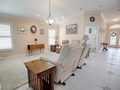 OPEN LIVING ROOM ... PLANTATIONS ON MOST WINDOWS.
