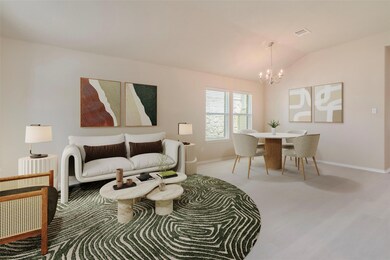 Living area with a chandelier, baseboards, and lo