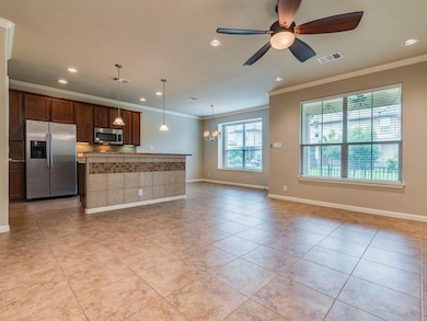 Unfurnished living room with crown molding, reces