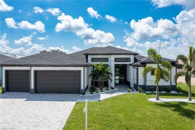 View of front facade with a front yard and a garage