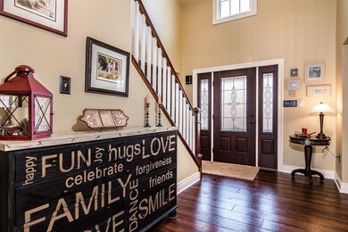 Nice, wide hallway provides plenty of room to greet your guests. Beautiful new Pella door