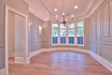 Gorgeous dining room with curved wall of windows a