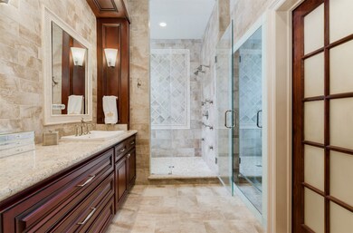 The master bath is the epitome of luxury. It is truly spa like with tiled walls, double full body shower and custom cabinets.