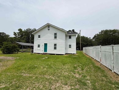 Back of property featuring entry steps