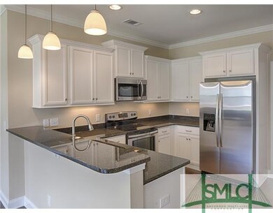 Kitchen. Alpine white cabinets with gleaming black