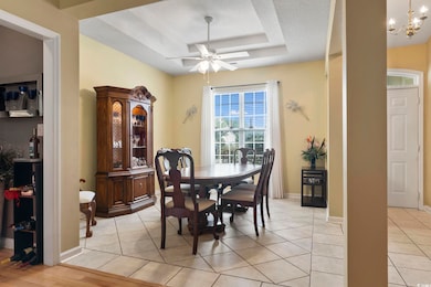 Dining space featuring a textured ceiling, light h